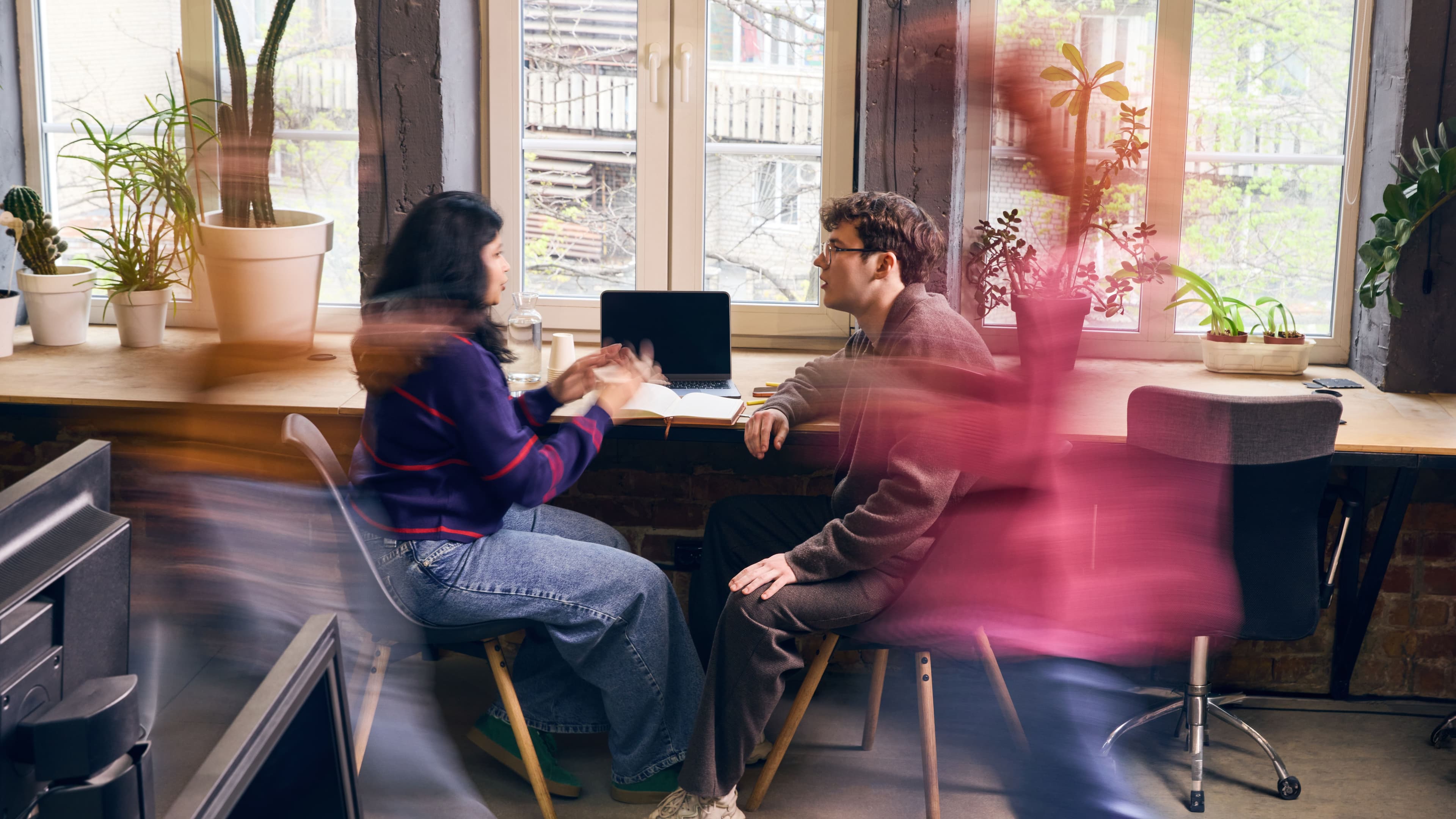 Two colleagues meeting in office